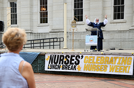 Dr. Donna Miles Curry on stage at Nurses Lunch Break