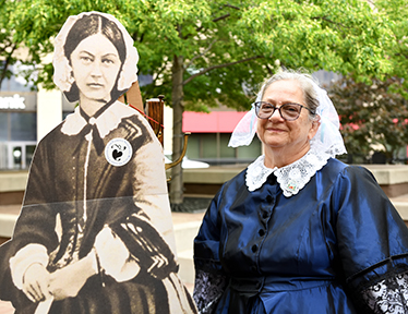 Dr. Donna Miles Curry in Nightingale dress with Florence figure